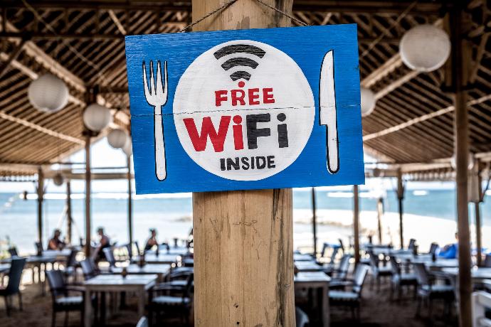 Free WiFi signage on wooden post